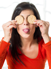 Woman taunting diet with crackers