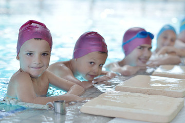 happy children group  at swimming pool