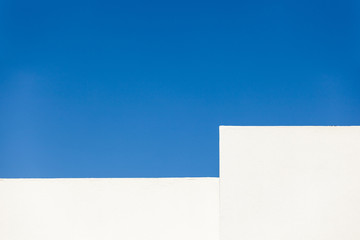 white wall under blue sky