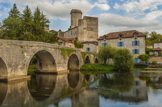 Bridge with Bourdeilles French castle in background