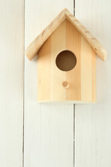 Nesting box on wooden background