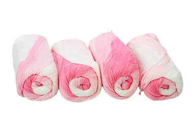 Skeins of white and pink thread.