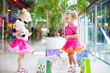little girls in a big shopping center