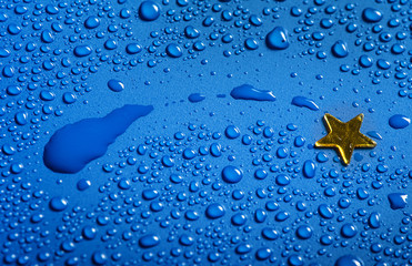 a little golden star and blue water dosps - christmas concept