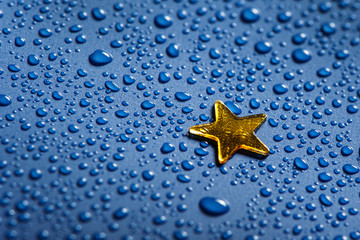 a little golden star and blue water dorops - christmas concept