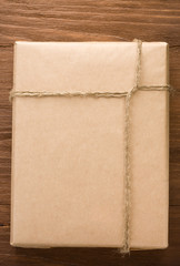parcel wrapped packaged box on wood