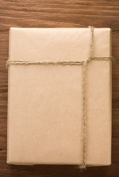 Parcel Wrapped Packaged Box On Wood