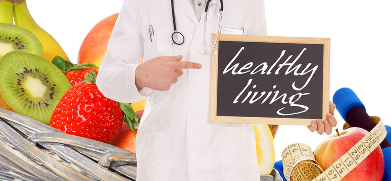fresh fruit and doctor with sign - healthy living