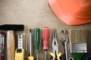 kit of construction tools on wood