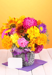 Beautiful bouquet of bright flowers with paper note