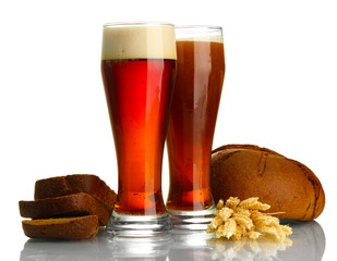 two glasses of kvass and rye breads with ears, isolated on