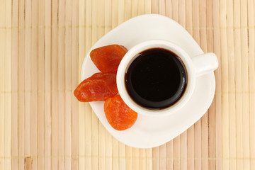 Cup of coffee on brown background