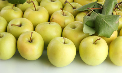 juicy apples with green leaves, isolated on white