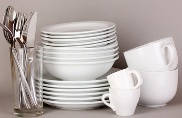 Clean white dishes on grey background