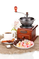 White cup of Turkish coffee with rahat delight and coffee mill