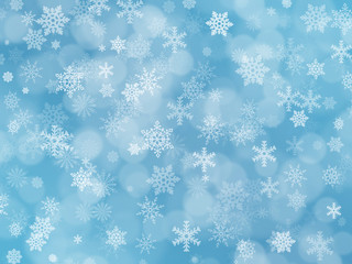 Blue winter background with snowflakes and boke effect