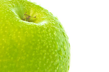 A fragment of a green apple on a white background