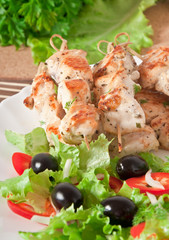 skewers of chicken with salad 