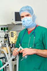 anesthesiologist in front of anesthetic machine