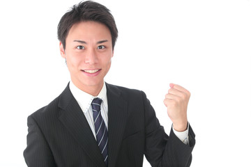 ガッツポーズの若いビジネスマン