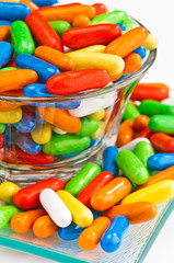 caramel colored capsules, filled licorice