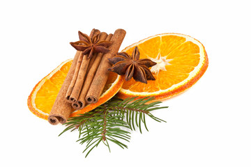 orange slices, cinnamon with fir branch isolated on white