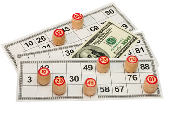 The lotto kegs on card and money isolated on a white background