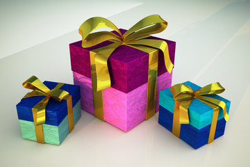 Three gift boxes with golden ribbons on white surface.