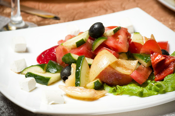 Vegetable salad on plate isolated on white