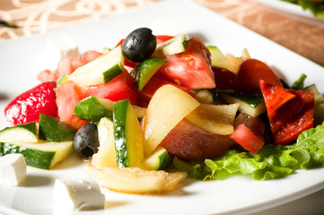 Vegetable salad on plate isolated on white