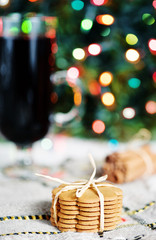 Cookies, spiced hot wine on the shiny background