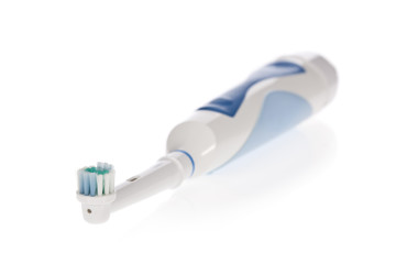 Electric toothbrush isolated on white background.