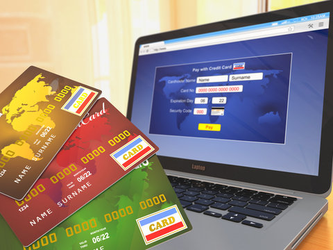 E-commerce. Credit cards on laptop
