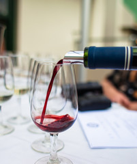 Pouring red wine