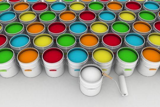open bucket with color paint and roller