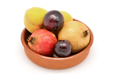 Fruits fall: plums, pomegranates and peaches