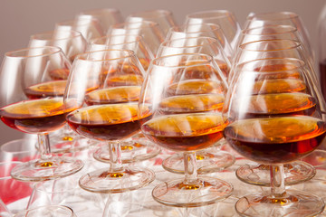 glasses of cognac on  festive table