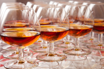 glasses of cognac on  festive table