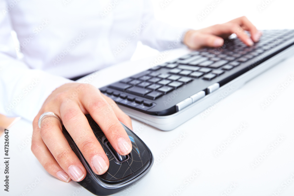 Fototapete Hand with a computer mouse.