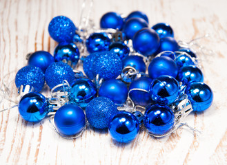 christmas baubles on rustic wooden background