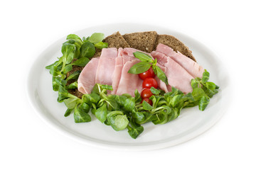 bread, ham, tomato served on a white  plate