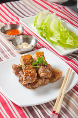 grilled pork wrapped in vegetables with garlic and soybean paste