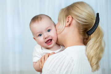loving mother holding baby boy