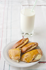 Homemade pastry and glass of milk.