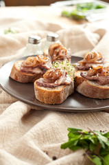 slice beef with onions on a bread