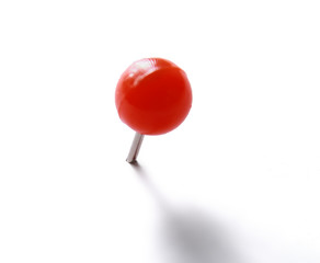 Red push pin isolated on white