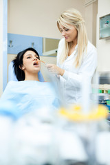 dentist assistant helping patient