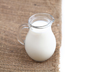 Glass jug with milk