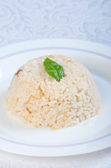buttery garlic rice with basil leaf