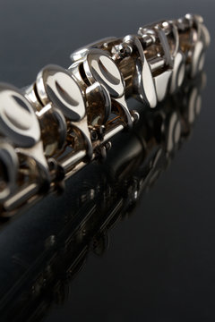 Detail of flute on a black background, with copy space